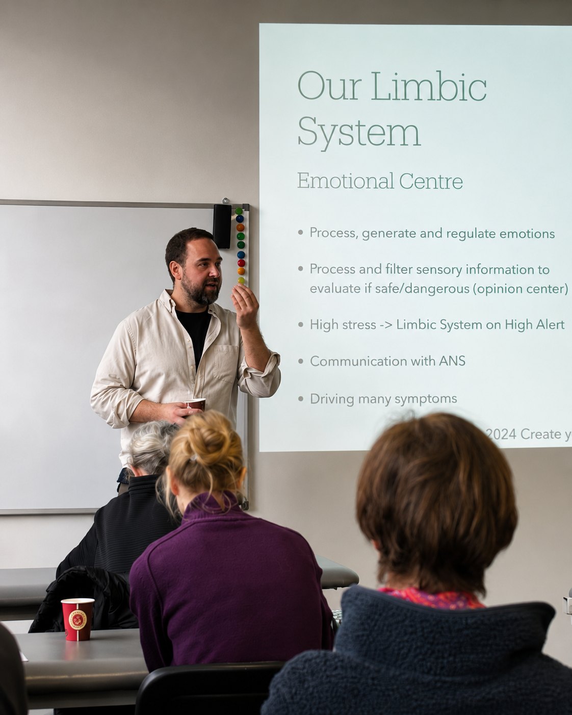 Jonatan teaching a live class on the nervous system to a seated group